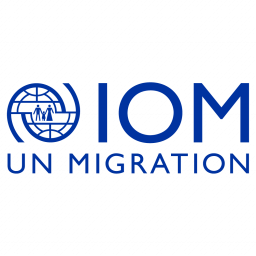 IOM UN Migration logo with blue text and globe icon